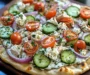 pizza topped with tzatziki sauce