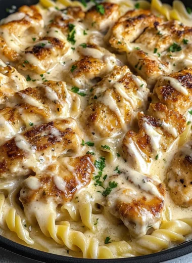 Cheesy Alfredo Twisted Pasta with Golden Garlic Butter Chicken in Creamy Sauce