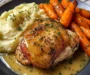 Herb-Roasted Chicken Thighs with Creamy Garlic Sauce, Mashed Potatoes & Glazed Carrots
